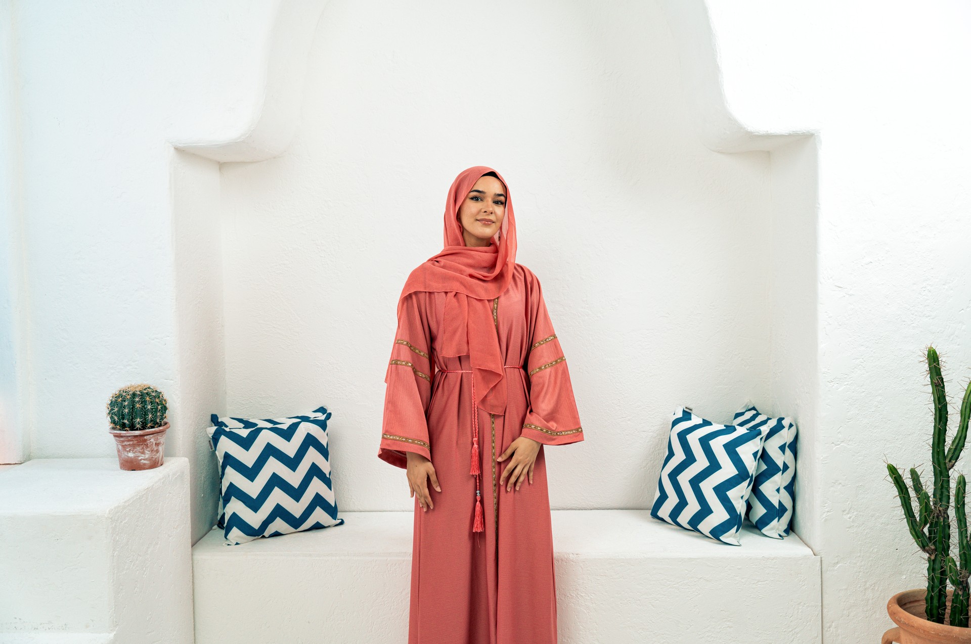 Beautiful young woman wearing colored abaya