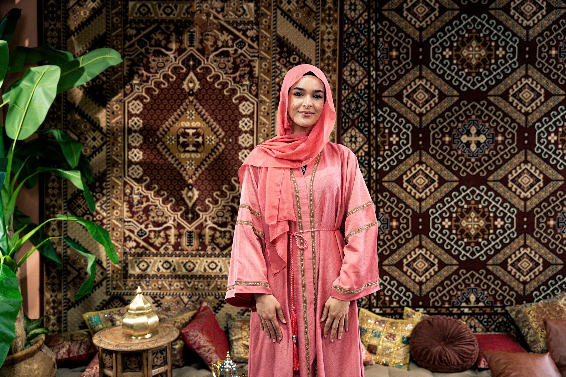 Beautiful young woman wearing colored abaya