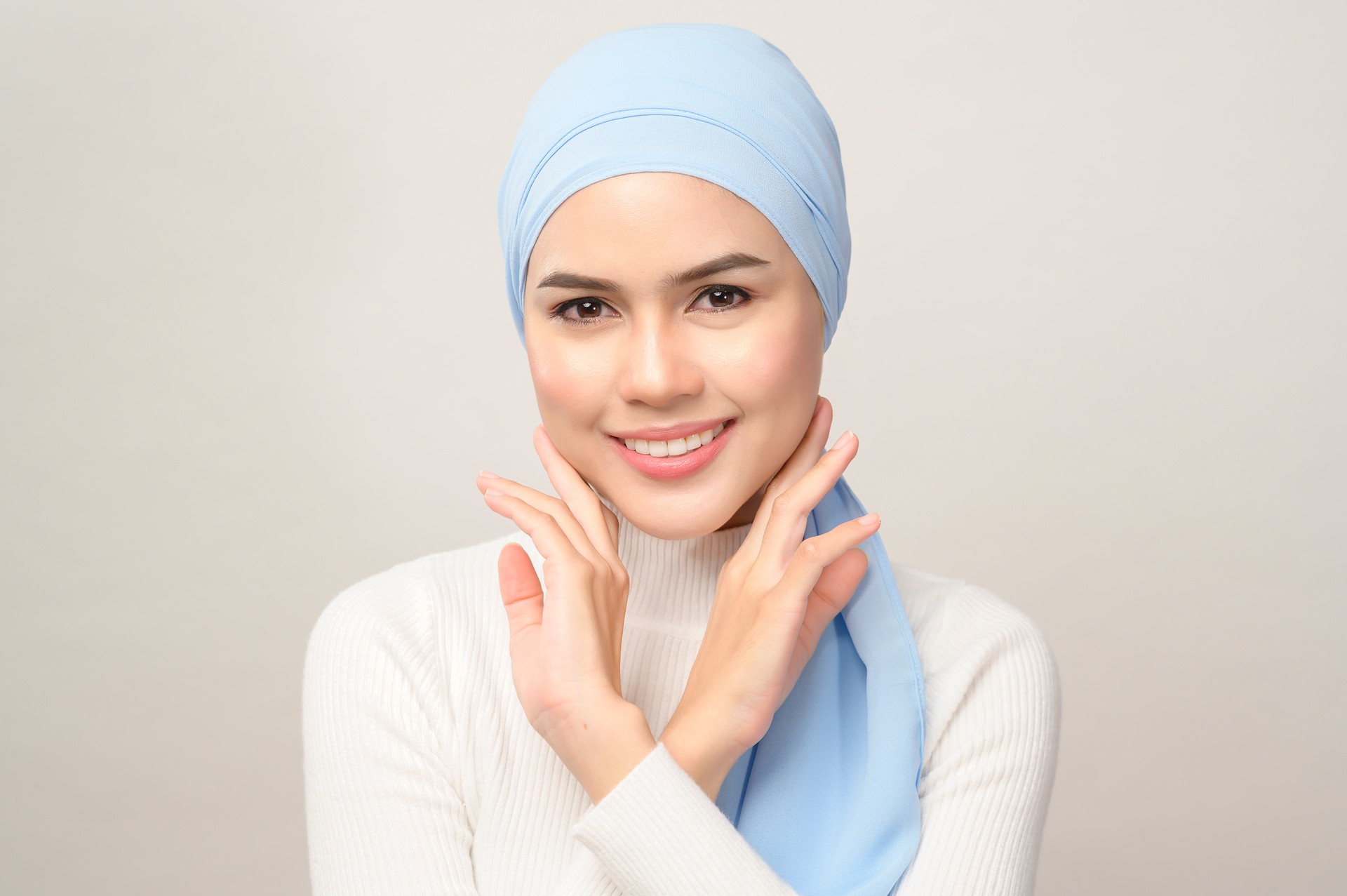 close up of young beautiful muslim woman with hijab isolated on white background studio, muslim beauty skin care concept.